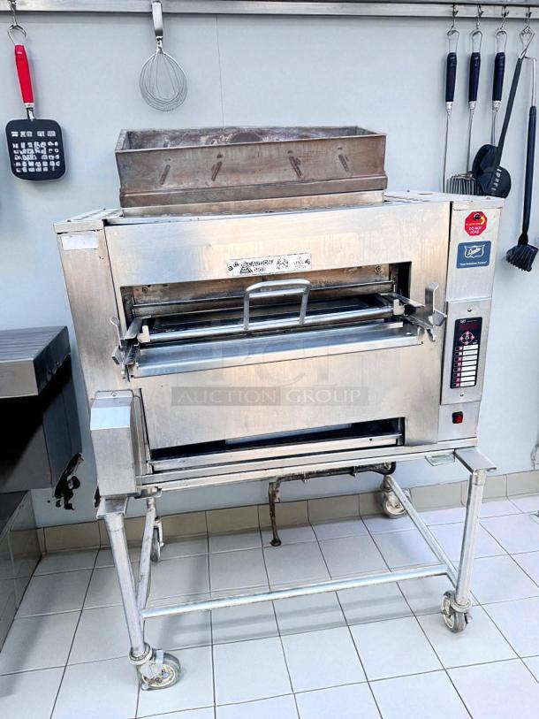 Duke FBB-NC-120 gas conveyor toaster oven in excellent condition, 43"W x 30"D x 53"H, natural gas, 120V, stainless steel.