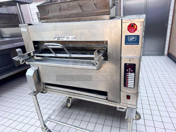 Duke FBB-NC-120 gas conveyor toaster oven in excellent condition, 43"W x 30"D x 53"H, natural gas, 120V, visible control panel and logos.