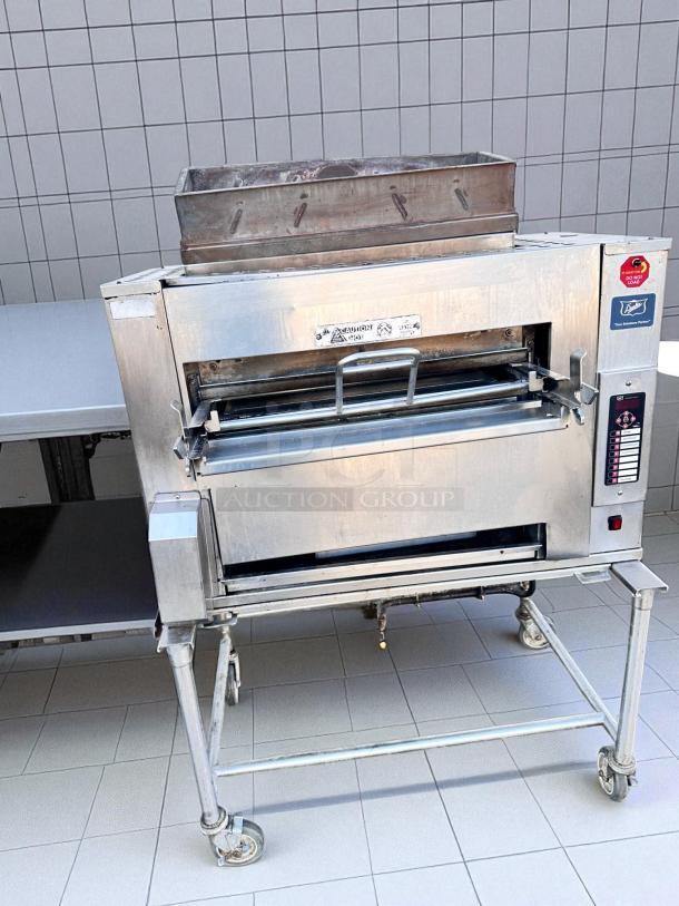 Duke FBB-NC-120 gas conveyor toaster oven, 43"W x 30"D x 53"H, natural gas, 120V, excellent condition, as is, visible controls.