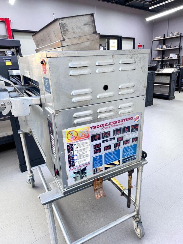 Duke FBB-NC-120 gas conveyor toaster oven, excellent condition, natural gas, 120V, 43"W x 30"D x 53"H, troubleshooting guide visible.