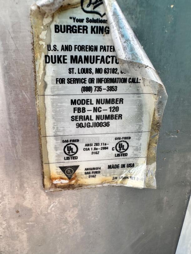 Tag on Duke FBB-NC-120 Gas Conveyor Toaster Oven; shows model number, UL certifications, and "Made in USA."