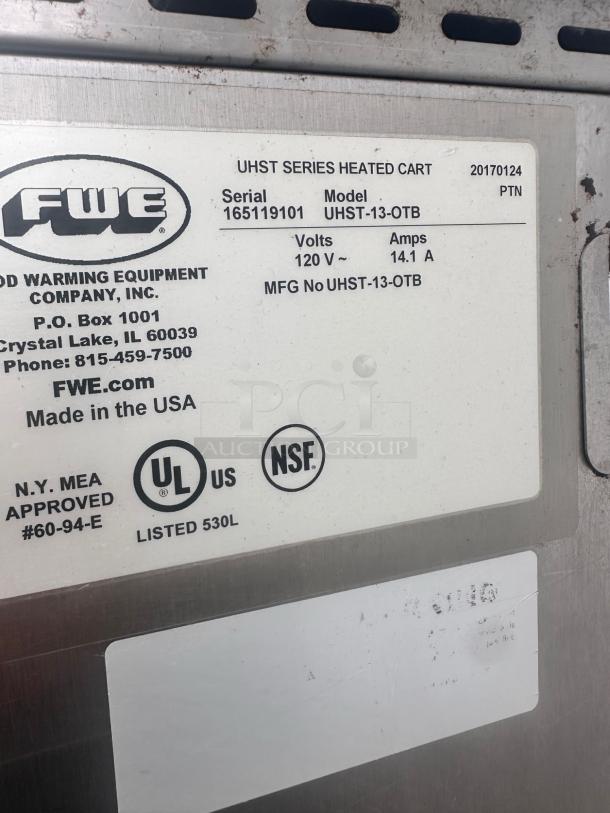 FWE UHST-13-OTB heated holding cabinet label, 120V, 14.1A, serial 165119101, UL and NSF certified, excellent condition.