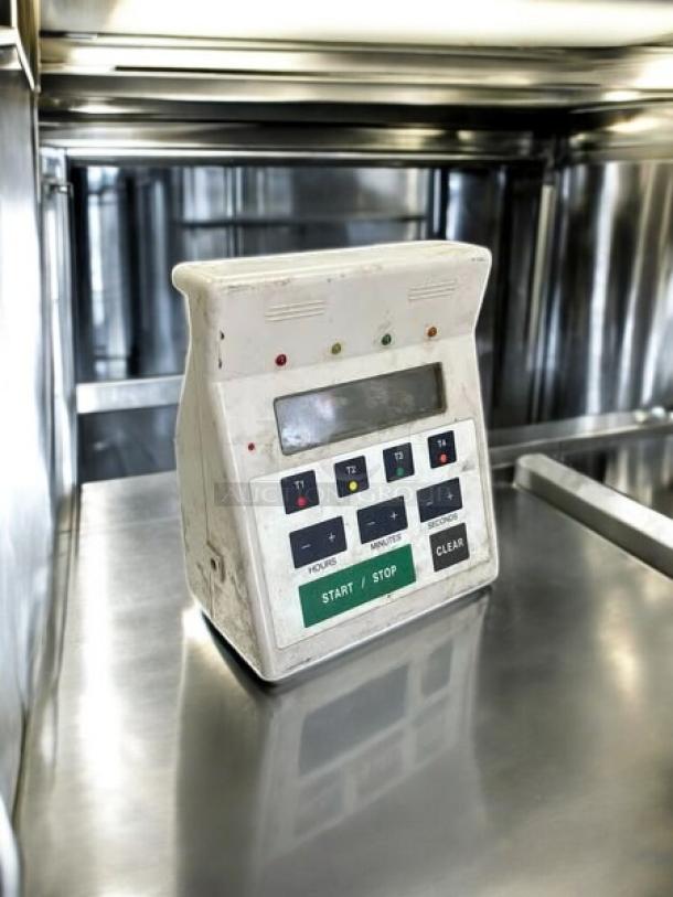 FMP 141-7501 commercial digital 4-channel timer, excellent condition. Features buttons for hours, minutes, start/stop.