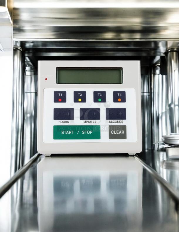 FMP 141-7501 commercial digital 4-channel timer, excellent condition, tested and working, branded control buttons visible.