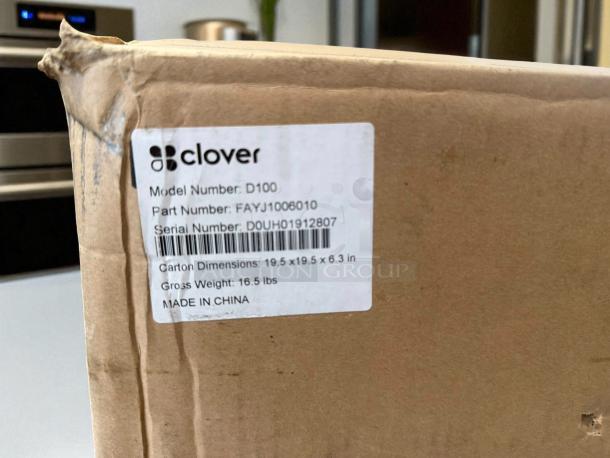Brand new Clover D100 cash drawer box with model, part, and serial numbers visible on label. Dimensions: 19.5x19.5x6.3 in.