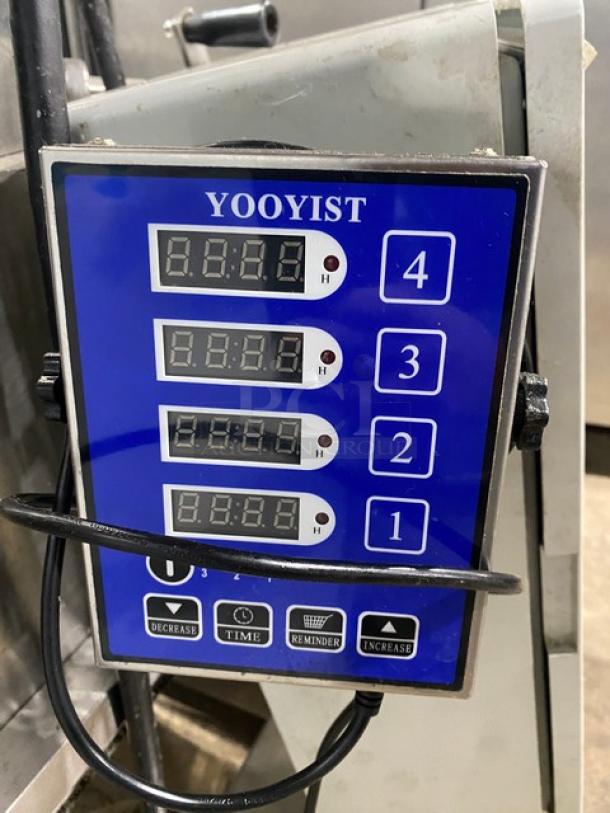 Commercial stainless steel electric food processing machine with Yooyist digital timer, heavy duty, shown in good condition.