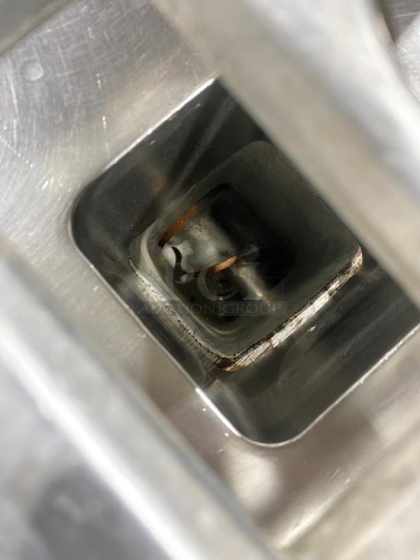 Hobart 4632A commercial meat grinder chute, stainless steel, model tag visible, some wear, free-standing on legs.