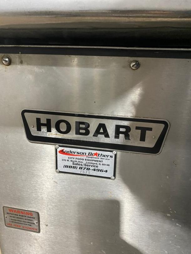 Hobart 4632A heavy-duty meat grinder, electric, 200V 3-phase, free-standing on legs, serial number 11-303-376, visible brand and service labels.