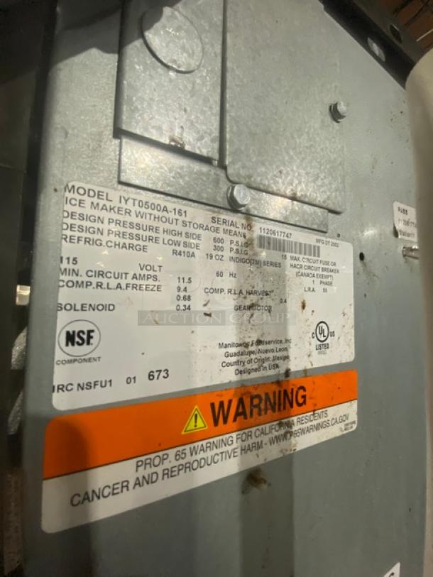 Manitowoc IYT0500A161 ice machine info label, showing model, serial number, voltage, and warnings. Energy Star certified.