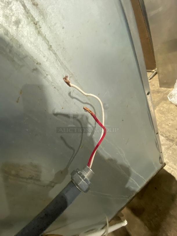 Manitowoc Indigo Series ice machine wiring, model IYT0500A161, shows exposed red and white wires next to a metal surface.