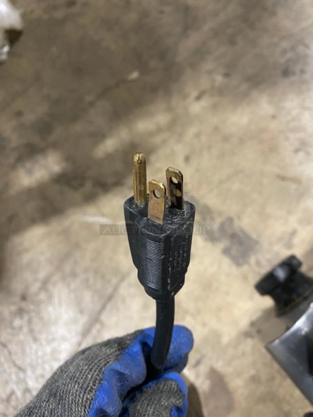 Power plug for Globe Commercial Electric Powered Countertop Heavy Duty Deli Meat Slicer, showing three-prong configuration.