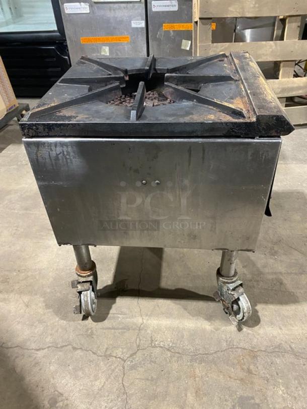 Commercial stainless steel natural gas single burner stock pot range on casters. Used condition, robust design.