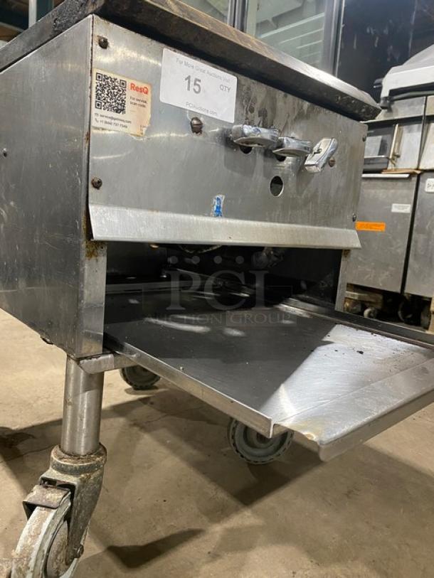 Commercial stainless steel natural gas single burner stock pot range on casters, durable, adjustable controls, good condition.