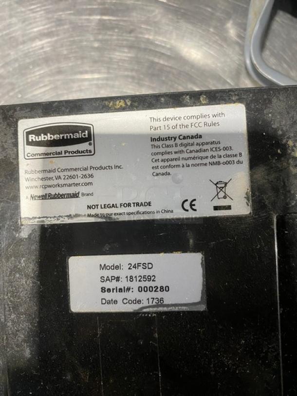 Rubbermaid Commercial 24 lb. Digital Scale, Model 24FSD, serial 000280; black base showing labels and compliance info.