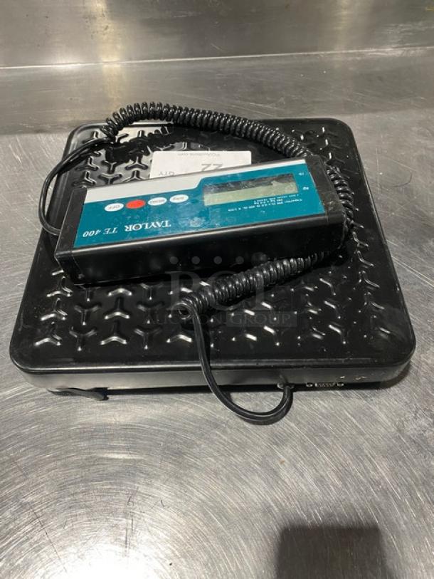 Taylor Precision Series TE400 digital receiving scale, black, 400 lb. capacity, with coiled cable keypad. Light wear visible.