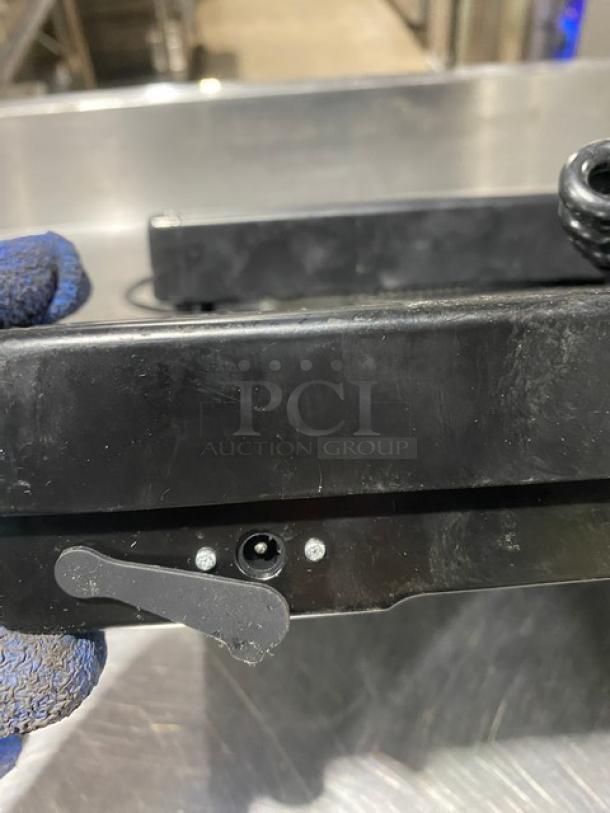 Taylor TE400 digital receiving scale in black. Features commercial precision, 400 lb. capacity. Condition appears used.