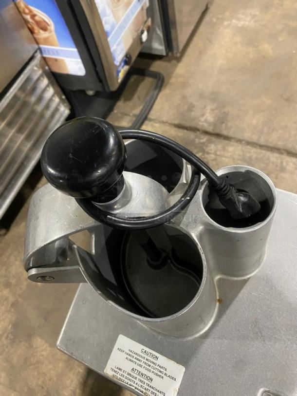 Robot Coupe CL50 food processor, industrial-grade, includes equipment stand/cart, visible power cord, in good condition.