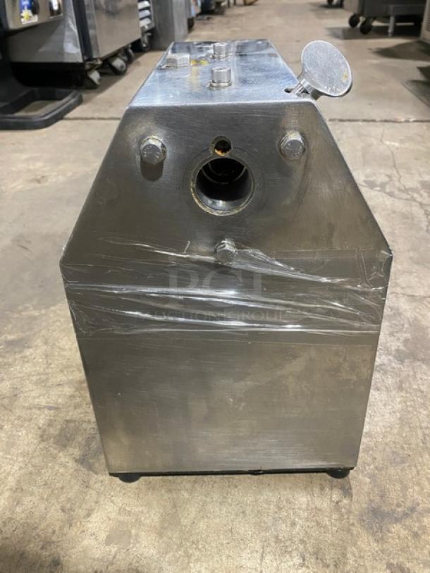 American Eagle AE-G22N stainless steel meat grinder, bench model, electric-powered, on legs, shown in used condition.