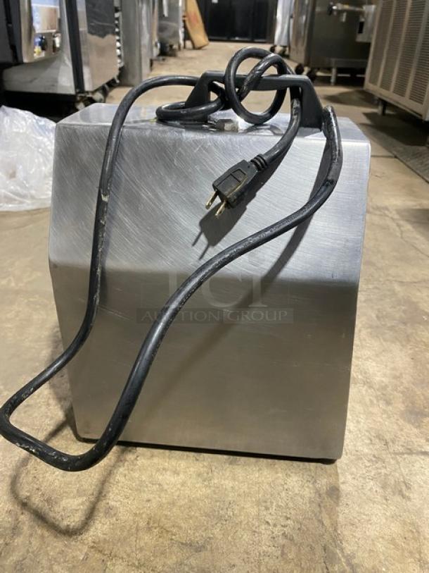 American Eagle stainless steel meat grinder, model AE-G22N, 115V, electric-powered, bench model on legs, visible power cord.