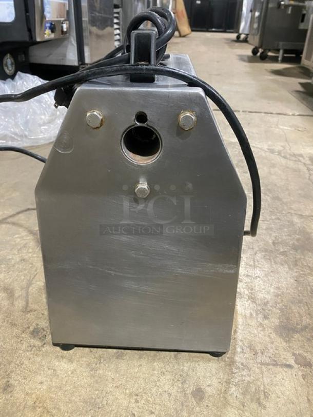 American Eagle AE-G22N stainless steel electric meat grinder, bench model, 115V, 1 phase, slightly used, on legs.