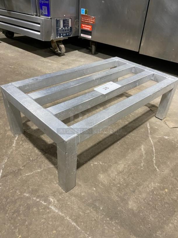 Heavy-duty commercial dunnage rack on legs, metal, rectangular, sturdy construction, grey finish, excellent condition.