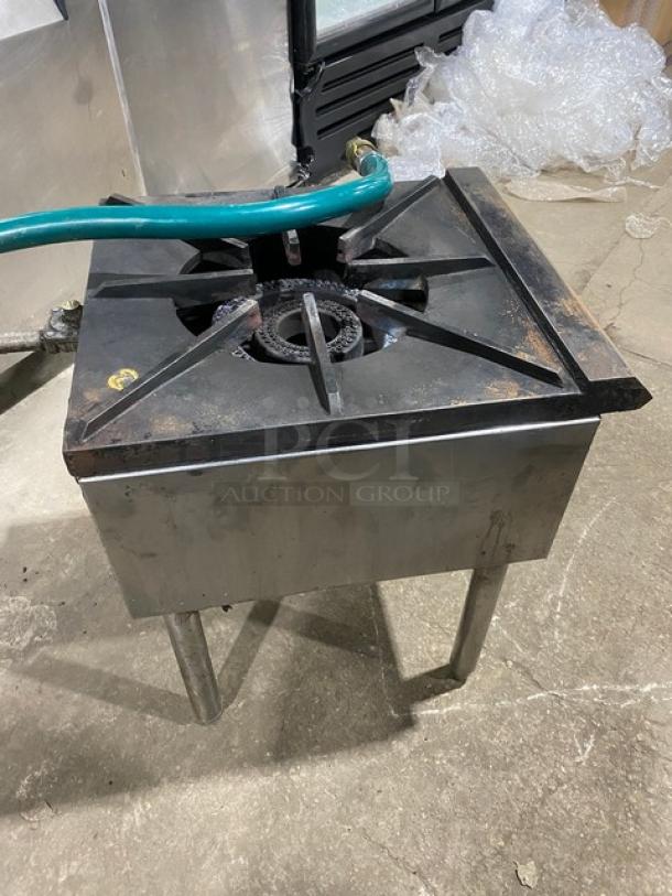 U.S. Range stainless steel single burner stock pot range, natural gas-powered, includes gas connection hose, on legs.