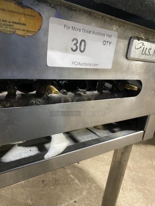 U.S. Range commercial stainless steel natural gas single burner stock pot range with gas connection hose; on legs. Visible auction tag.