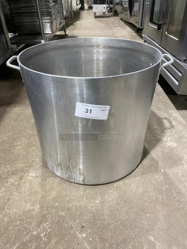 Commercial heavy-duty round stock pot with handles, metal, label indicates auction item number 31, showing signs of use.