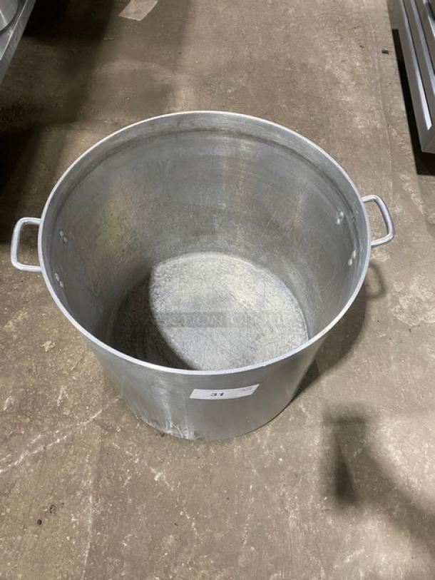 Commercial heavy-duty round stock pot with handles, metal finish, slight wear, ideal for large-scale cooking.