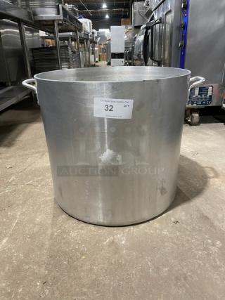 Commercial heavy-duty round stock pot with handles, large capacity, sturdy construction, visible usage marks, item tag "32".