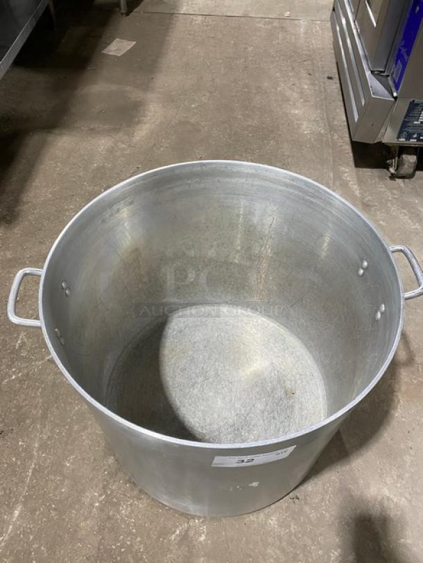 Commercial heavy-duty round stock pot with handles, silver, used condition, ideal for large-scale cooking.