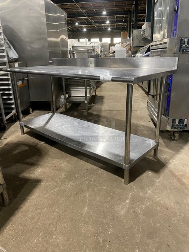 KCS commercial stainless steel worktop table with undershelf and up-turned backsplash on sturdy legs. Excellent condition.