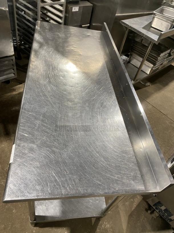 KCS stainless steel worktop table with undershelf, up-turned backsplash, on sturdy legs. Good condition, ideal for commercial use.