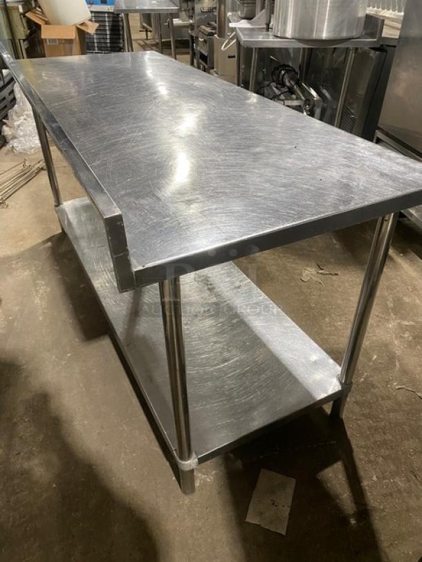 KCS commercial stainless steel worktop table with single undershelf and up-turned backsplash. On sturdy legs. Used condition.