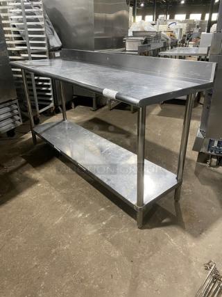 KCS commercial stainless steel worktop table with undershelf, up-turned backsplash, and sturdy legs, in good condition.