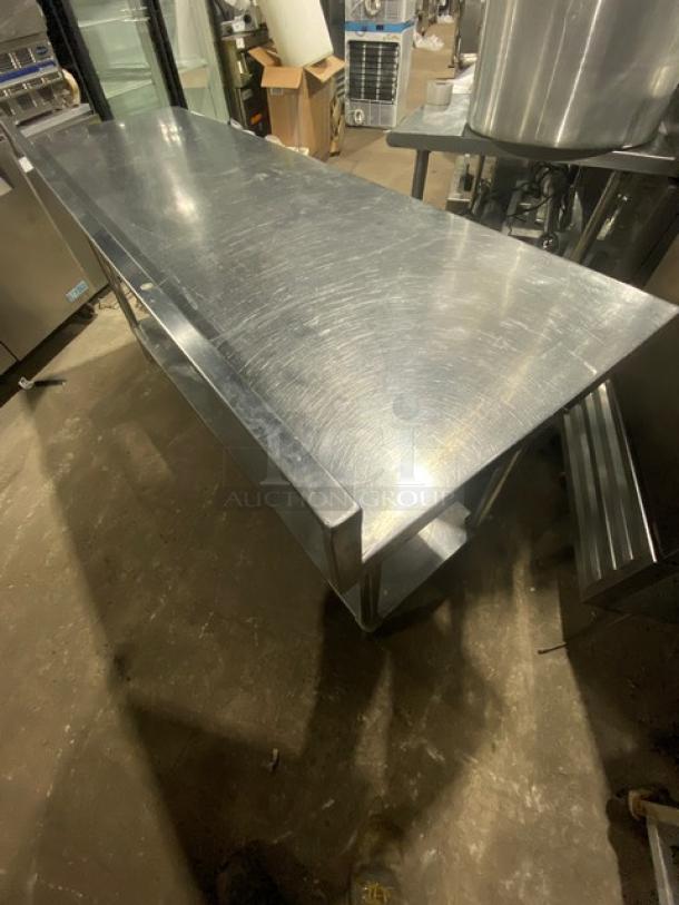 KCS stainless steel worktop table, single undershelf, upturned backsplash, sturdy legs; commercial-grade, good condition.