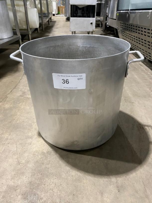 Commercial heavy-duty round stock pot with handles, metal construction, shows minor wear. Label reads: "36, PCAuctions.com".