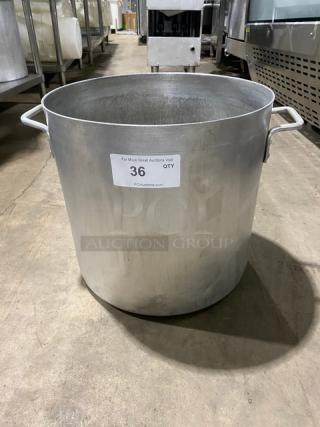 Commercial heavy-duty round stock pot with handles, metal construction, shows minor wear. Label reads: "36, PCAuctions.com".