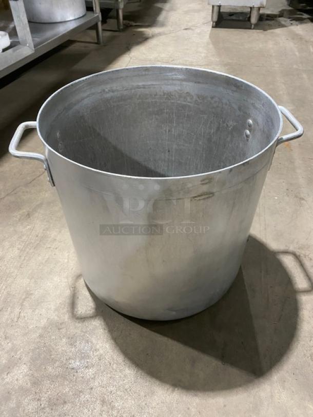 Commercial heavy-duty round stock pot with handles, metal construction, used condition, ideal for large-scale cooking.