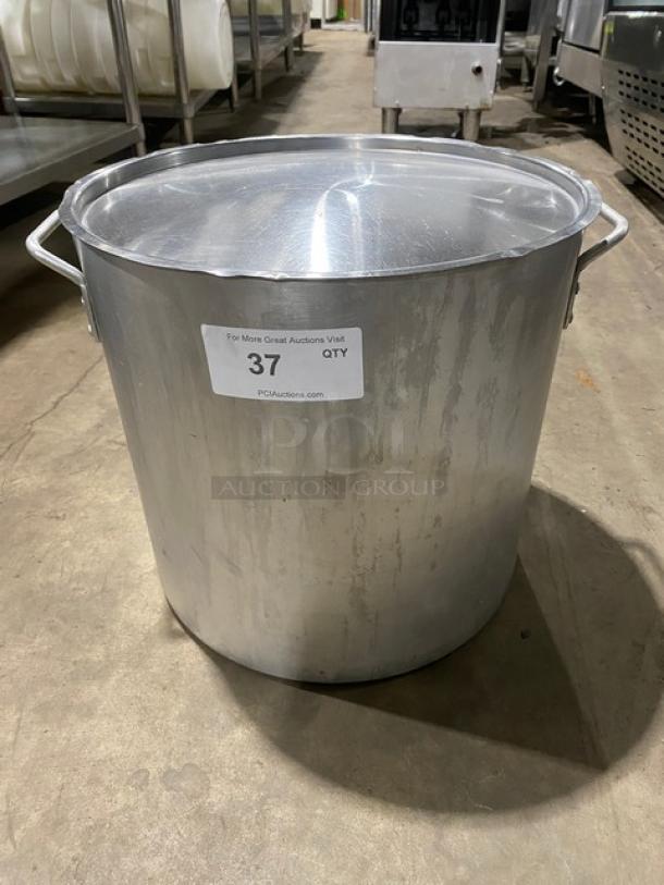 Commercial heavy-duty round stock pot with lid and handles, stainless steel, used condition. Label "37 QTY" visible.