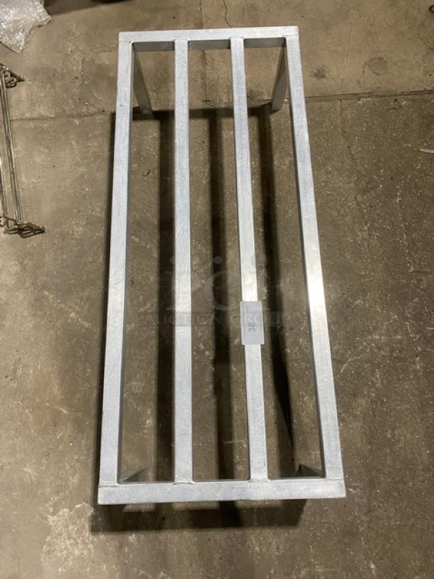 Commercial heavy duty dunnage rack on legs, metal construction, sturdy design, minor wear, ideal for storage needs.