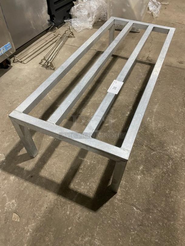 Commercial heavy-duty dunnage rack with metal frame on legs, excellent condition, ideal for storage and industrial use.