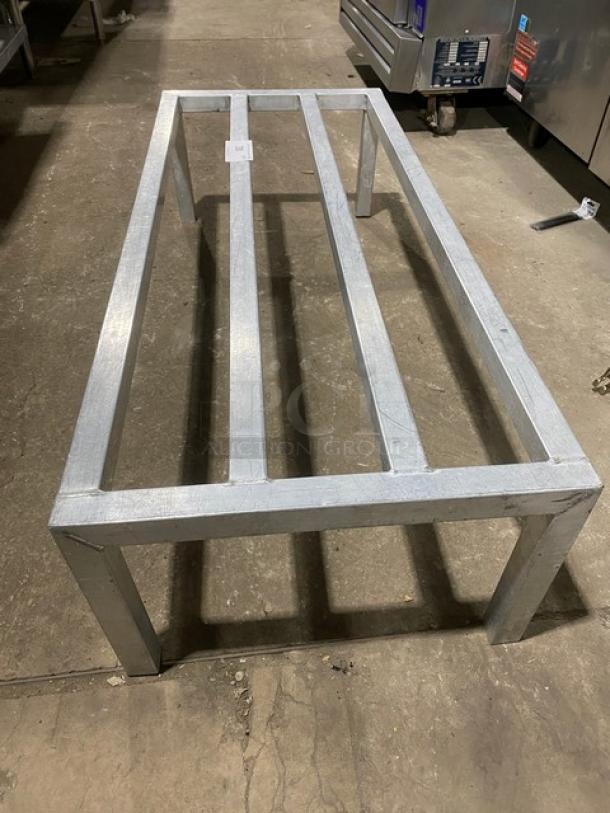 Commercial heavy duty dunnage rack with legs, metal construction, excellent condition, ideal for storage organization.