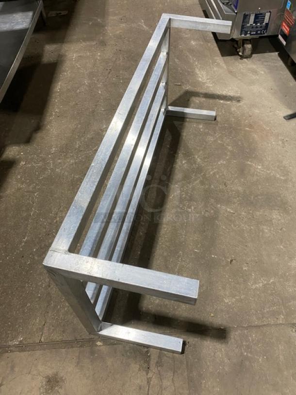 Commercial heavy duty dunnage rack on legs, metal construction, excellent condition, ideal for storage solutions.