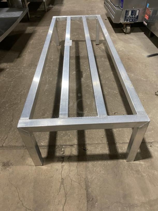 Stainless steel commercial heavy-duty dunnage rack on legs, excellent condition, ideal for storage, sturdy construction.