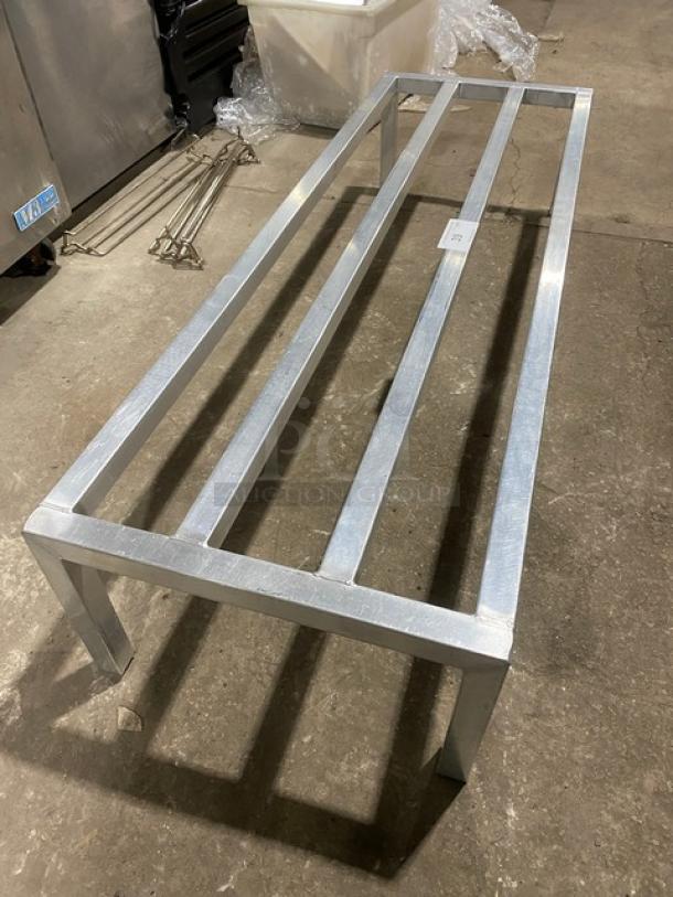 Commercial heavy-duty dunnage rack with metal frame and legs, excellent condition, ideal for storage and organization.