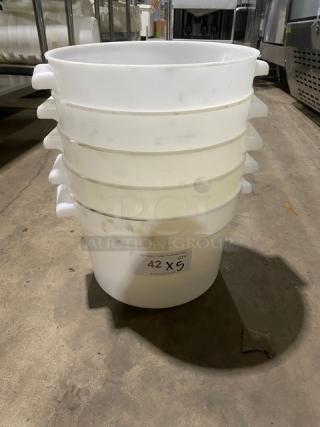 Commercial white round food storage container with handles, stack of five, used condition, labeled "42 X 5" on the side.