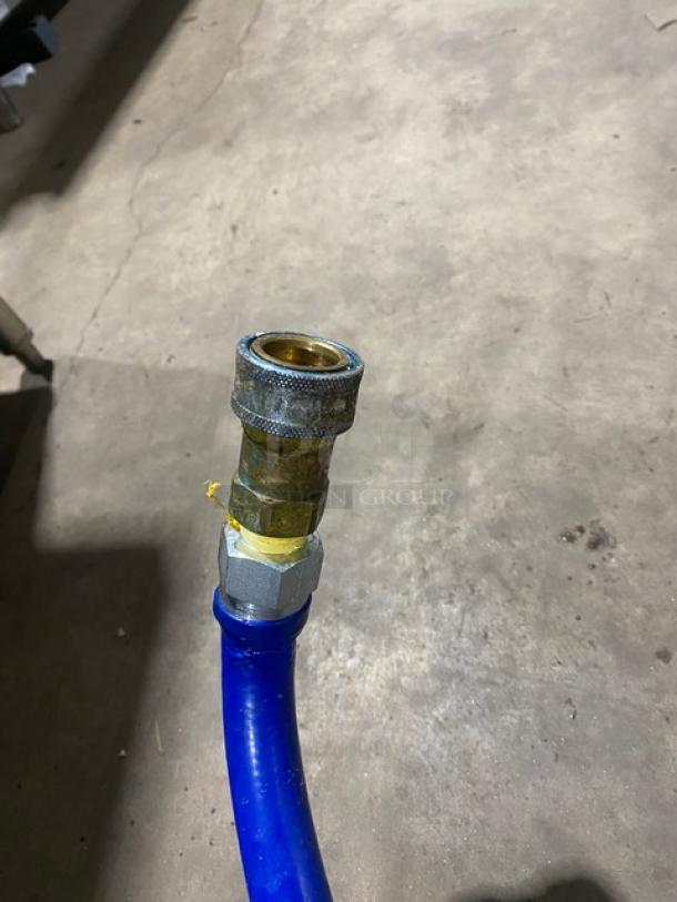 Dormont commercial blue gas connector hose with brass fittings, showing durable construction and good condition.