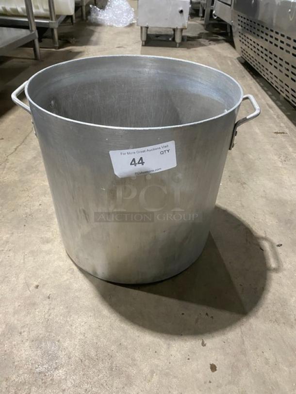Commercial heavy-duty round stock pot with handles, in stainless steel. Visible label showing auction number 44.