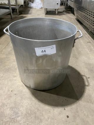 Commercial heavy-duty round stock pot with handles, in stainless steel. Visible label showing auction number 44.